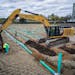 Workers dig a filtration system at the Highland Bridge development in St. Paul in May 2021. The St. Paul City Council will consider amendments to the 