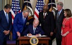 President Joe Biden signed the Democrats’ landmark climate change and health care bill at the White House on Tuesday with leaders of Congress.