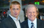 Actor Brad Pitt, left, and German director Wolfgang Petersen appear at the world premiere of the film “Troy” in Berlin, Germany, on May 9, 2004. P