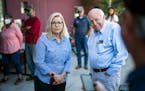 Rep. Liz Cheney, R-Wyo., arrives, with her father, former Vice President Dick Cheney, to vote at the Teton County Library in Jackson Hole, Wyo., for T