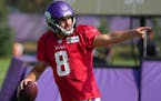 Minnesota Vikings quarterback Kirk Cousins (8) points to his receiver during a joint practice session with the San Francisco 49ers Wednesday.