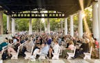 People gather at an evening vigil for author Salman Rushdie after was attacked on Aug. 12 in Chautauqua, N.Y. Rushdie, whose novel “The Satanic Vers