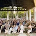 People gather at an evening vigil for author Salman Rushdie after was attacked on Aug. 12 in Chautauqua, N.Y. Rushdie, whose novel “The Satanic Vers