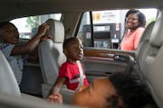 Jessica Loveless pumped gas into her vehicle while her sons Zyaire, 5, Zion, 7, and Zakari, 1, waited Wednesday at a Speedway gas station in Hastings.