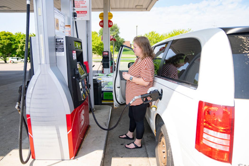 Elle Sammons pumped gas into her minivan Wednesday, August 17, 2022 at a Speedway gas station in Hastings