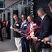 Digi-Key founder Ronald Stordahl cut a Digi-reel tape during a ribbon cutting ceremony and grand opening for its Product Distribution Center Expansion