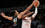 Aces center Kiah Stokes blocked a shot by Mercury guard Diamond DeShields during the second half of Las Vegas’ 79-63 victory in Game 1 of a WNBA fir