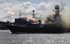 A warship launches anti-submarine rockets during a rehearsal for the Naval parade in Baltiysk, a Navy base in Russian Baltic Sea exclave, Russia, Thur