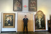 Revere Auctions co-founder Sean Blanchet in front of a collection of angel paintings from Aveda and Intelligent Nutrients founder Horst Rechelbacher t