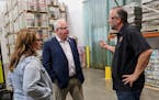 Lt. Gov. Peggy Flanagan, Gov. Tim Walz and Castle Danger Brewery co-owner Lon Larson tour the brewery Thursday.