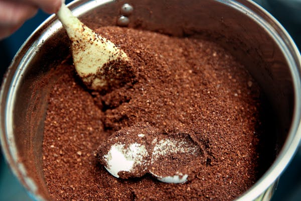 Egg coffee is made by mixing two cups of coffee grounds with one egg and stirring it all together, then poor the grounds into a boiling pot of water a
