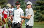 San Francisco 49ers head coach Kyle Shanahan, left, and general manager John Lynch watch their team during a joint practice Wednesday with the Vikings