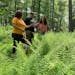 Forester Sarah Hall-Bagdonas talks with landowners Sara Velazquez and Dan Nelson at their property in Wayne County, Pennsylvania, in June. 