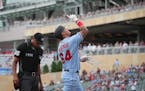 Minnesota Twins first baseman Jose Miranda (64) points to the sky after hitting a home run in the bottom of the first inning which also drove in Minne