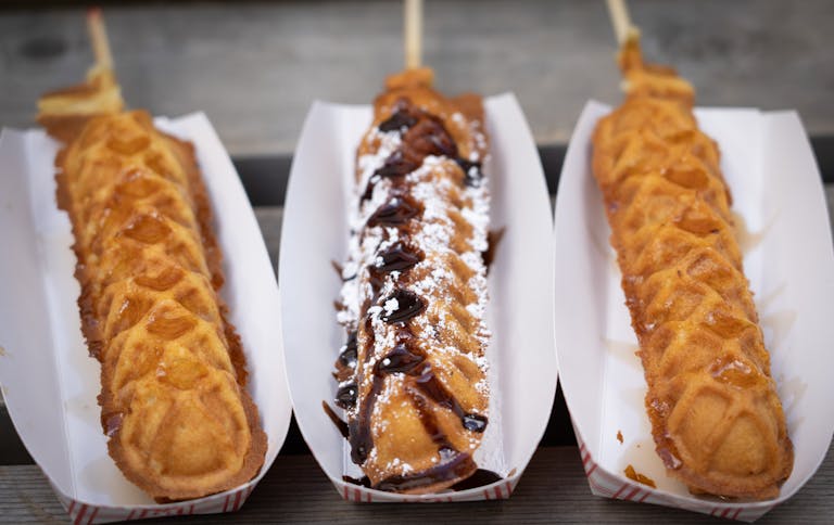 Breakfast Sausage in a Waffle On-A-Stick, Brownie Waffle Stick and Chicken in a Waffle On-A-Stick from Waffle Chix. New foods at the Minnesota State F