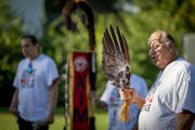 Mitch Walking Elk, who has been a member of the American Indian Movement since 1974, blessed participants during a ceremony in Minneapolis on Thursday