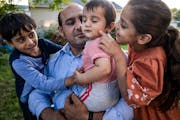 Roman Khan is grateful that his children Yusuf, 5, Hamza, 10 months, and Mina, 6, get to grow up in St. Paul Park, not under Taliban rule.