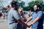 Sam Ward and Ryan Wooldridge exchanged vows under the Great Big Wheel on the first Friday of the Minnesota State Fair.
