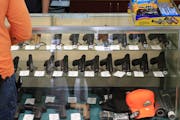Handguns on display at a Honolulu gun shop. A lawsuit challenging Minnesota’s age limit for permits to carry handguns in public is attracting interv