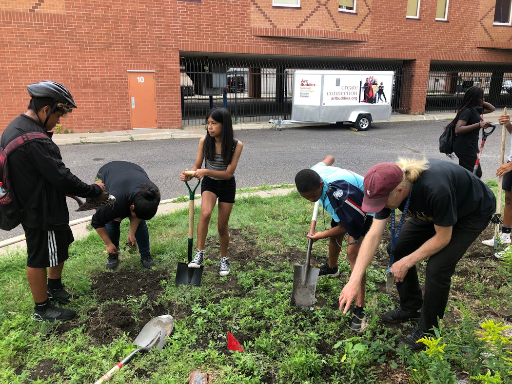 Jeff Carlson helped a crew transform a weedy patch at Whittier School into a pollinator garden while others tended to trees and vegetable gardens at the school-park complex in south Minneapolis.