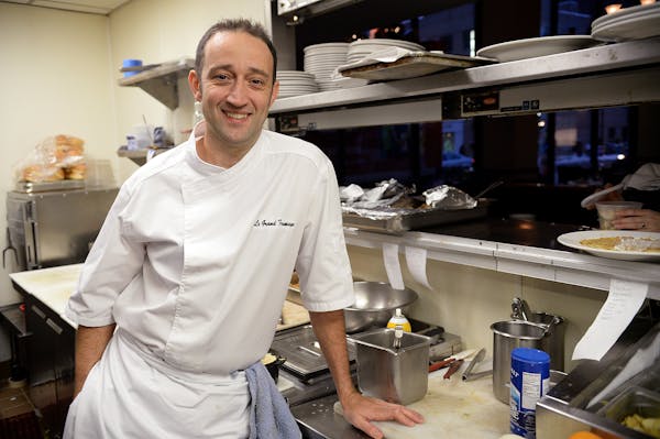 Vincent Francoual, here in the kitchen at his seminal Vincent A Restaurant, will open a new restaurant in downtown Minneapolis.