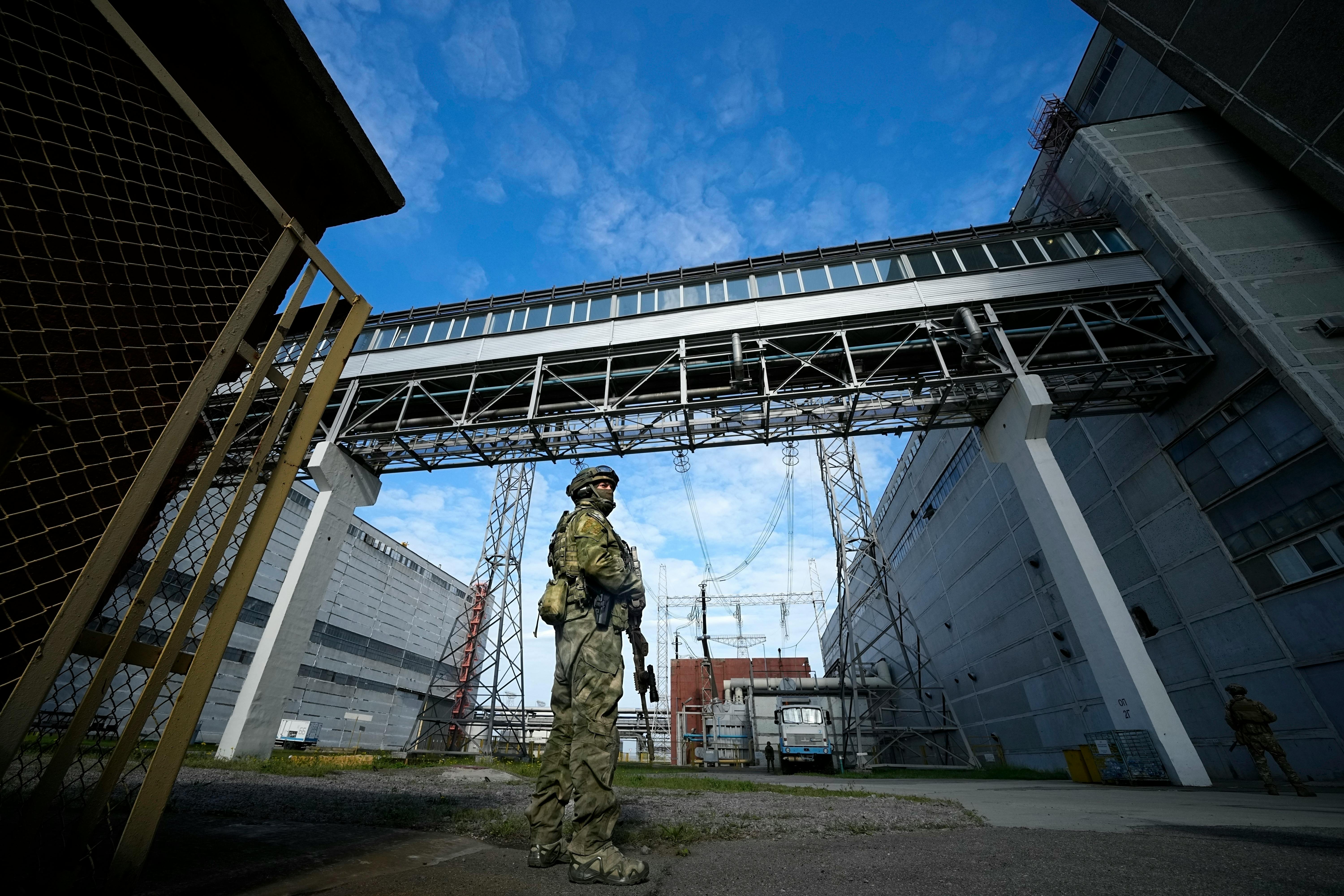A Russian serviceman guards an area of the Zaporizhzhia Nuclear Power Station in southeastern Ukraine on May 1. The nuclear power plant, built during 