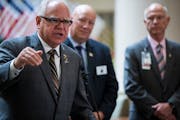 Gov. Tim Walz left, Veterans Affairs Commissioner Larry Herke , and Patrick Kelly, director of the Minneapolis VA were seen on Sept. 18, 2019. On the 