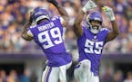 Danielle Hunter and Za’Darius Smith celebrated a sack in the first quarter vs. the Packers.
