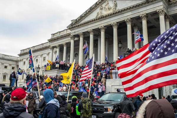 Supporters of President Donald Trump storm the Capitol in Washington, Jan. 6, 2021. The Justice Department has issued about 40 subpoenas over the past
