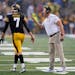 Iowa offensive coordinator Brian Ferentz talks with quarterback Spencer Petras (7) during Saturday’s 10-7 loss to Iowa State.