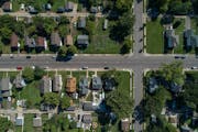Scars from the 2011 tornado are still visible in the Willard-Hay neighborhood in Minneapolis, where undeveloped lots and a lack of tree canopy stand i