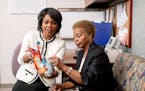 Dr. LaPrincess Brewer, left, a preventive cardiologist at Mayo Clinic, explained heart health to Jackie Johnson, a member of Christ’s Church of the 