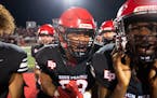 Eden Prairie tight end Jermell Taylor (83) celebrates with his teammates after they defeated top ranked Lakeville South 21-6.