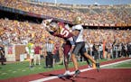 Dylan Wright (5) caught a touchdown pass for the Gophers, despite tight coverage from Colorado’s Kaylin Moore (0) on Sept. 17, 2022 at Huntington Ba