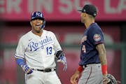 The Royals’ Salvador Perez celebrated his first-inning RBI double in front of Twins shortstop Carlos Correa in Kansas City’s 5-2 victory Wednesday