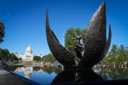 The Minnesota Medial of Honor Memorial, built around the existing “Promise of Youth” sculpture, was unveiled during a dedication Thursday on the S