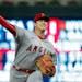 Shohei Ohtani throws to a Twins batter during the third inning Friday