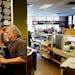 The Brother’s Deli owner Jeff Burstein, 73, looks over a sandwich order earlier this month.