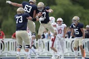 Bethel running back Bryce Kunkle (47) celebrated a first quarter touchdown against St. John’s on Saturday, Sept. 24, 2022 in Arden Hills. 