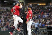 Twins catcher Gary Sanchez celebrated with first baseman Luis Arraez after hitting a three-run homer against the Angels on Saturday night.