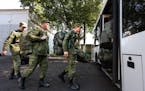 Russian recruits take a bus near a military recruitment center in Krasnodar, Russia, Sunday, Sept. 25, 2022. 