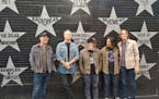 “Are you using the wide angle so my shoes are in it?” Jason Isbell, second from left, asked while posing with the 400 Unit in his First Avenue-bra