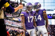 Vikings wide receiver K.J. Osborn (17) celebrates his game-winning touchdown with tight end Irv Smith Jr. on Sunday against the Lions. 