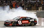 Tyler Reddick burns his tires after winning the the NASCAR Cup Series race at Texas Motor Speedway on Sunday