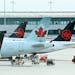 FILE - In this Wednesday, Oct. 14, 2020 file photo, Air Canada planes sit on the tarmac at Pearson International airport during the COVID-19 pandemic 
