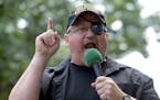 In this June 25, 2017 file photo, Stewart Rhodes, founder of the citizen militia group known as the Oath Keepers speaks during a rally outside the Whi