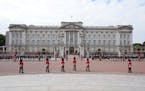 Buckingham Palace household staff pay their respects outside Buckingham Palace in London, during of the state funeral of Queen Elizabeth II at Westmin