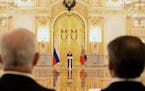 Russian President Vladimir Putin, center, delivers a speech as he attends a ceremony to receive credentials from newly appointed foreign ambassadors t