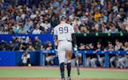 New York Yankees’ Aaron Judge stands at the plate during a break in play in the 10th inning Monday.