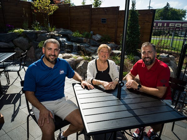 Zeina Jacob and her sons, Paul and Mark Jacob, on the patio at Schullers Tavern in Golden Valley. The patio was the dream of family patriarch Ray Jaco